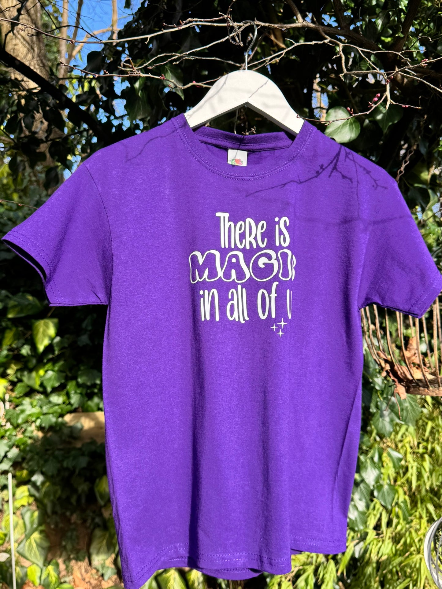 "There is MAGIC in all of us" purple slogan kids t-shirt