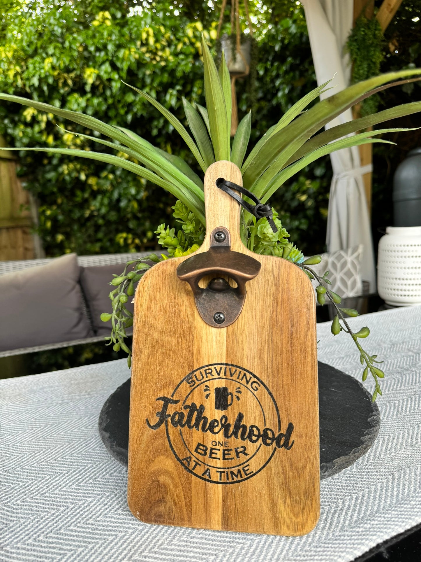 Wooden bottle opener 'SURVIVING FATHERHOOD ONE BEER AT A TIME'