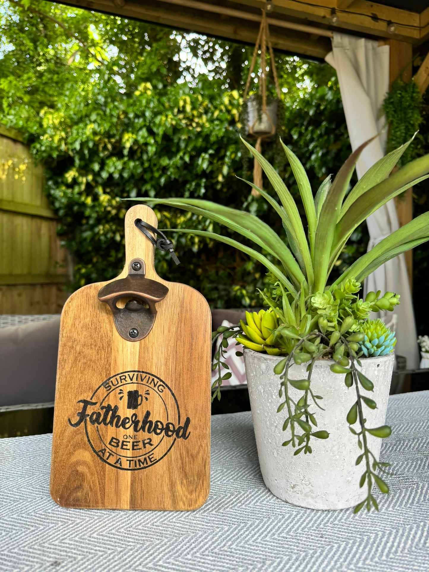 Wooden bottle opener 'SURVIVING FATHERHOOD ONE BEER AT A TIME'